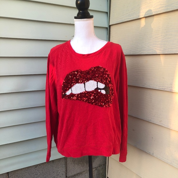 red jumper with sequin lips